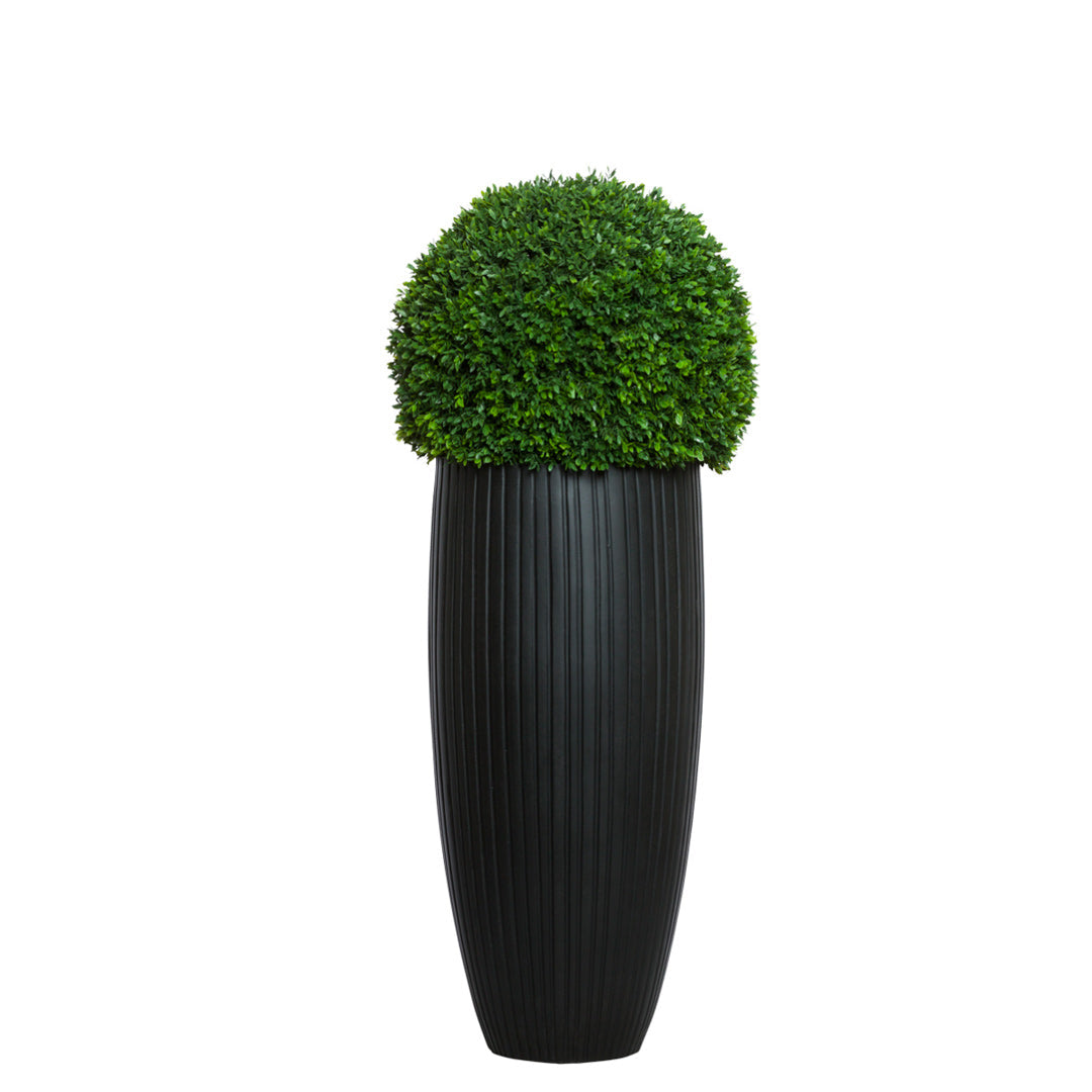 Artificial boxwood topiary in tall black ribbed planter, modern indoor decor