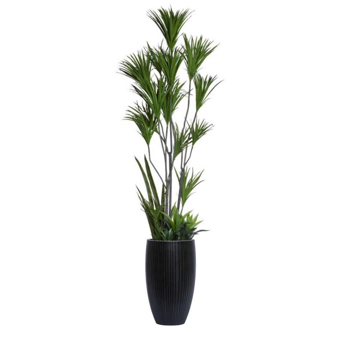 Artificial dracaena plant with spiky green leaves in tall black ribbed planter