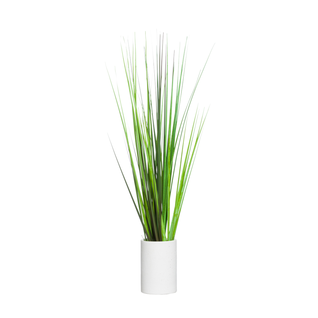 Tall artificial grass spray in a simple white pot on a white background