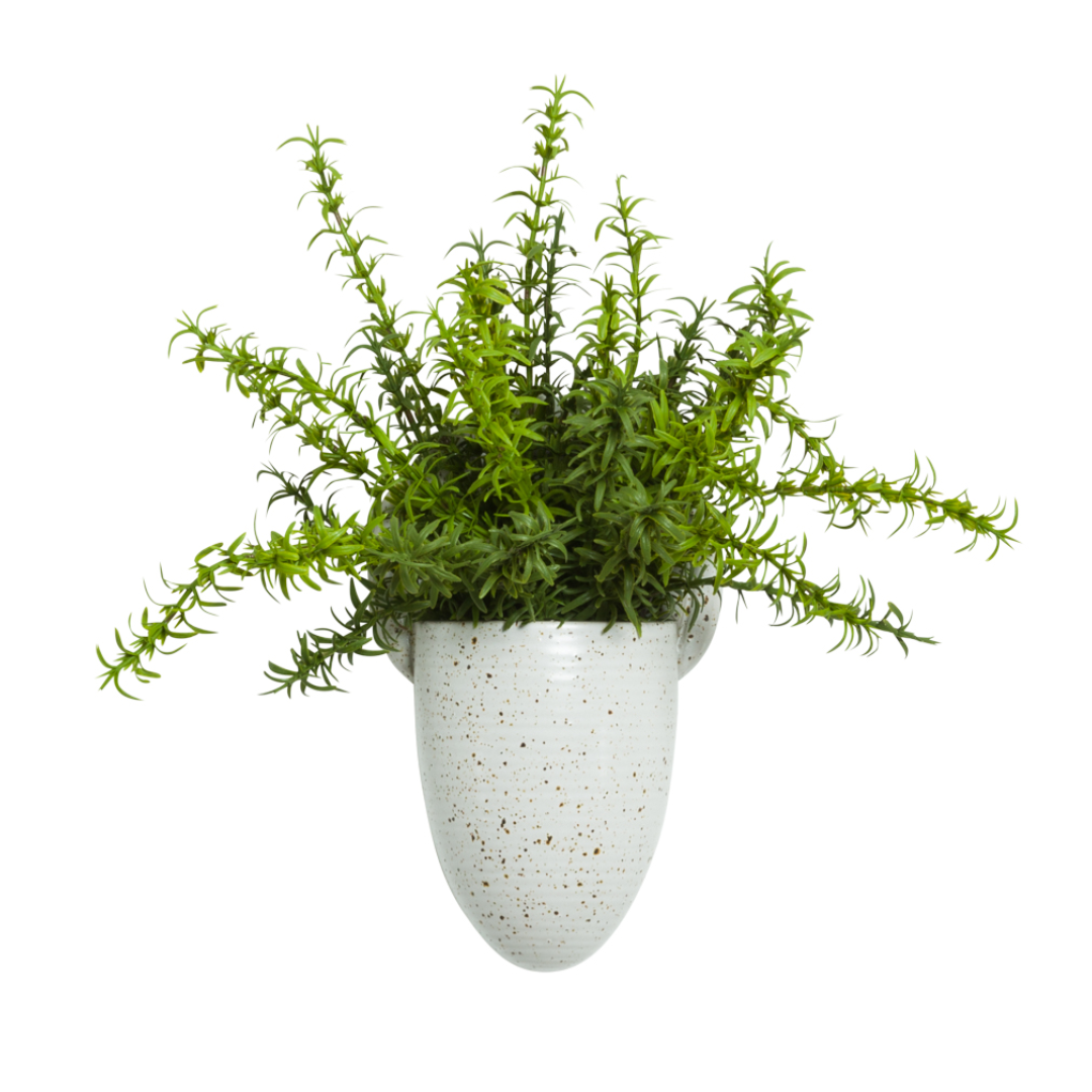 Artificial green grass plant in white speckled ceramic wall pocket planter