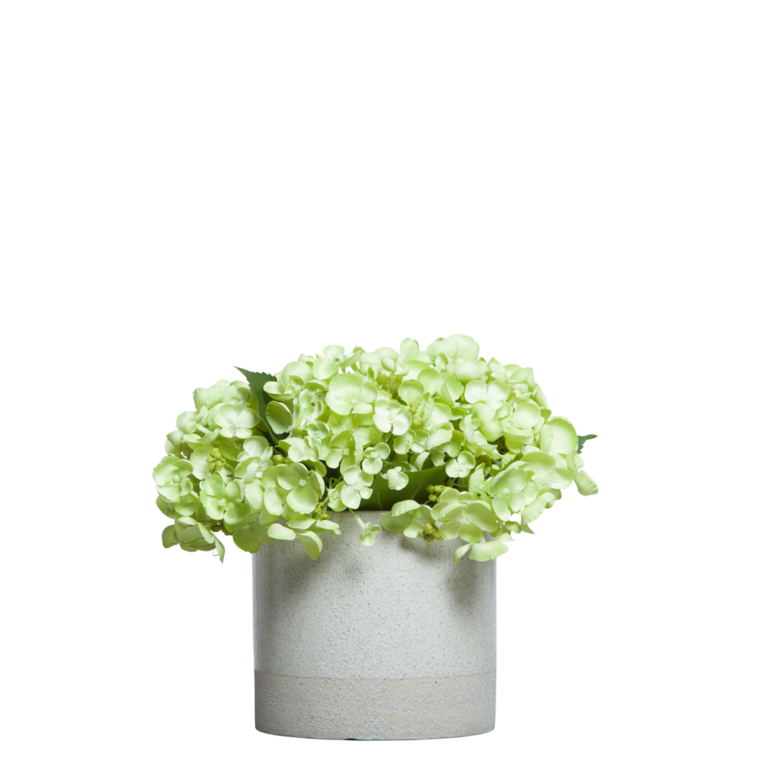 Green hydrangea artificial flower arrangement in a modern white ceramic pot