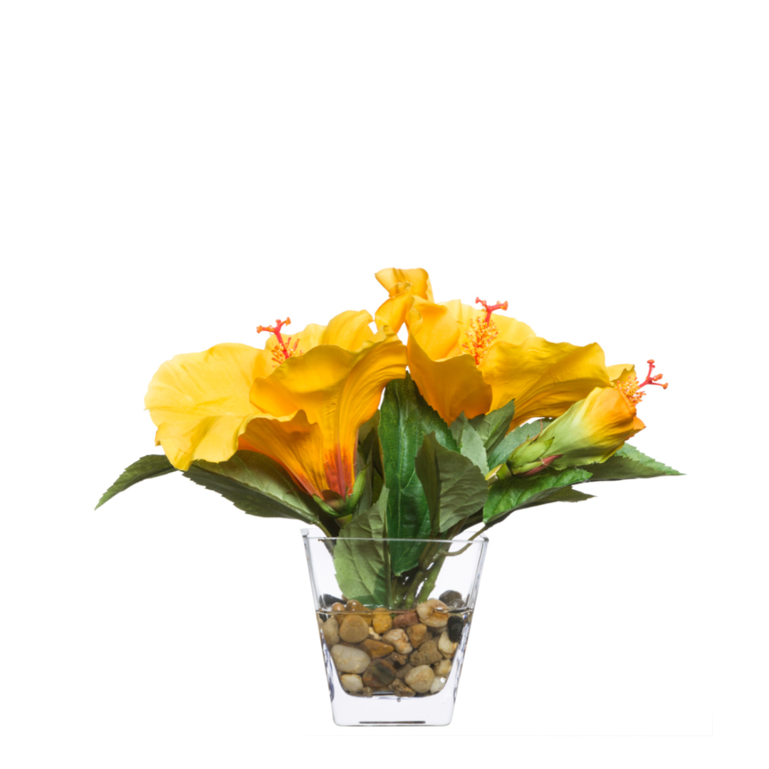 Artificial yellow hibiscus arrangement in clear glass vase with stones, realistic floral decor