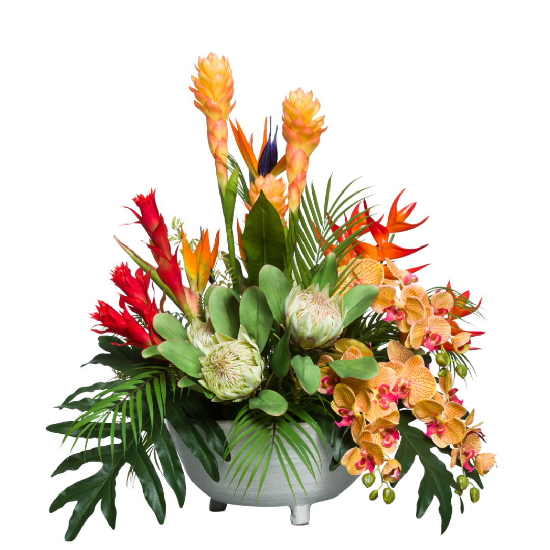 Artificial tropical floral arrangement with protea, orchids, and greenery in a modern bowl
