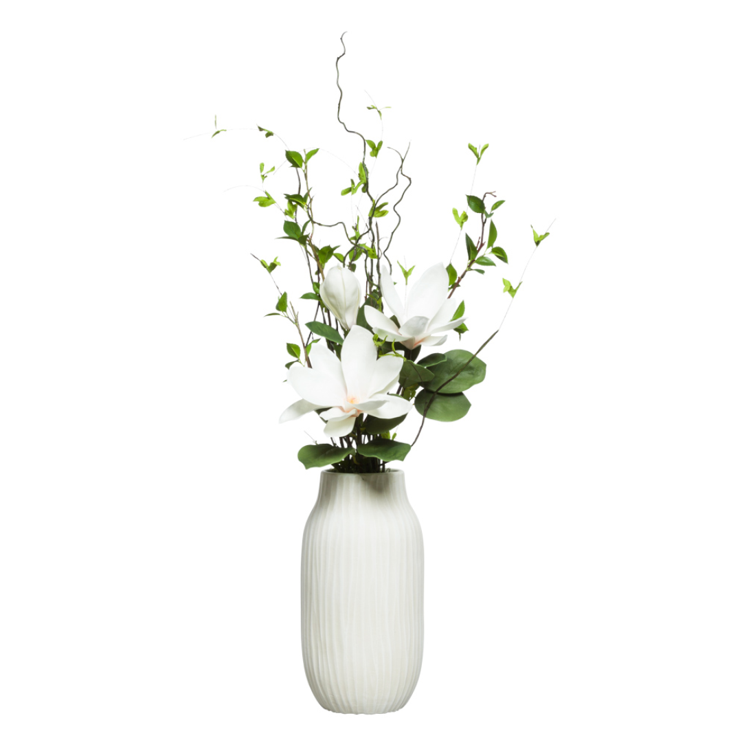 Magnolia birch artificial floral arrangement in a white ceramic vase with green foliage