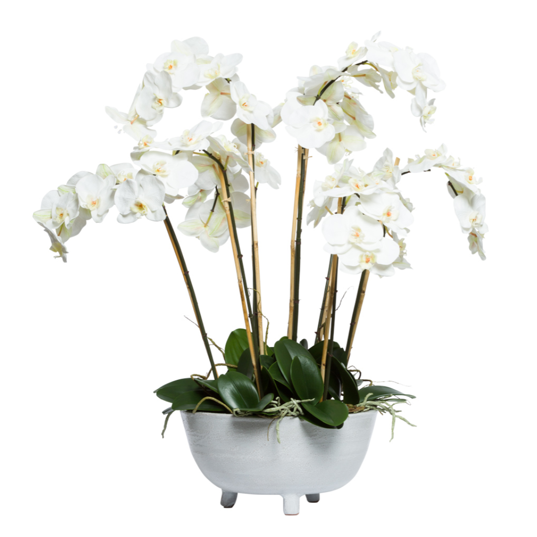 Artificial white Phalaenopsis orchid arrangement in a modern gray pot