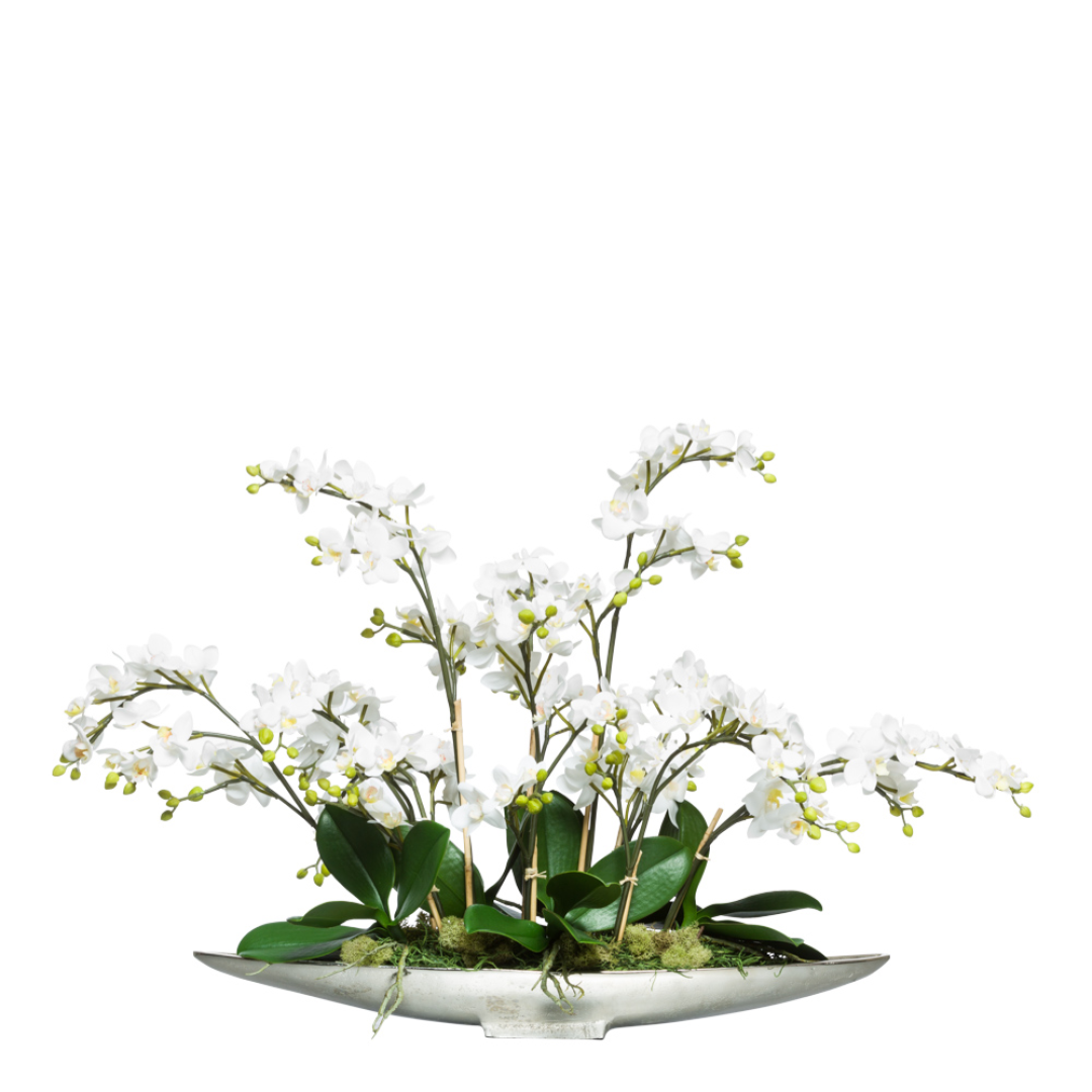 Artificial white phalaenopsis orchid arrangement in a modern silver boat-shaped planter