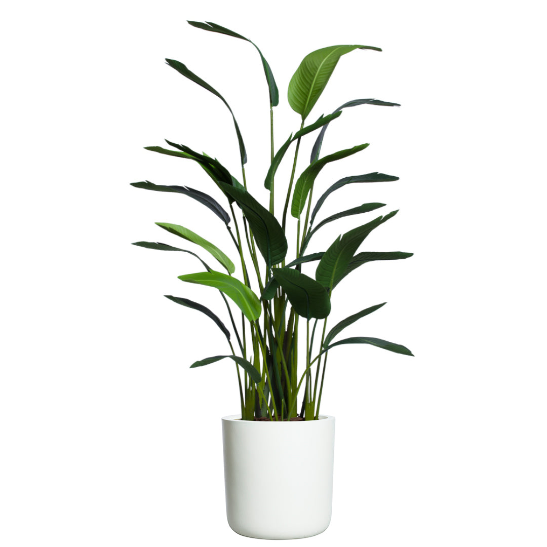 Artificial palm plant with long green leaves in a white planter, isolated on white background.