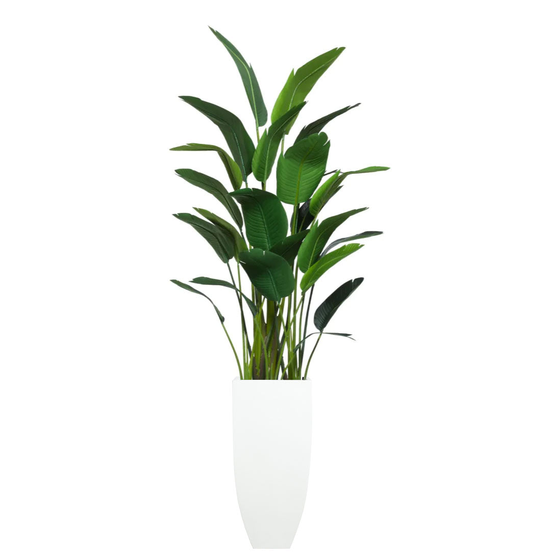Artificial palm plant in tall white planter, realistic green foliage, modern decor