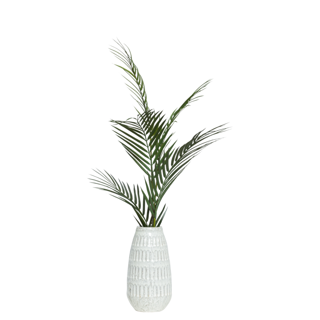 Artificial palm frond spray in a textured white ceramic vase, modern botanical decor