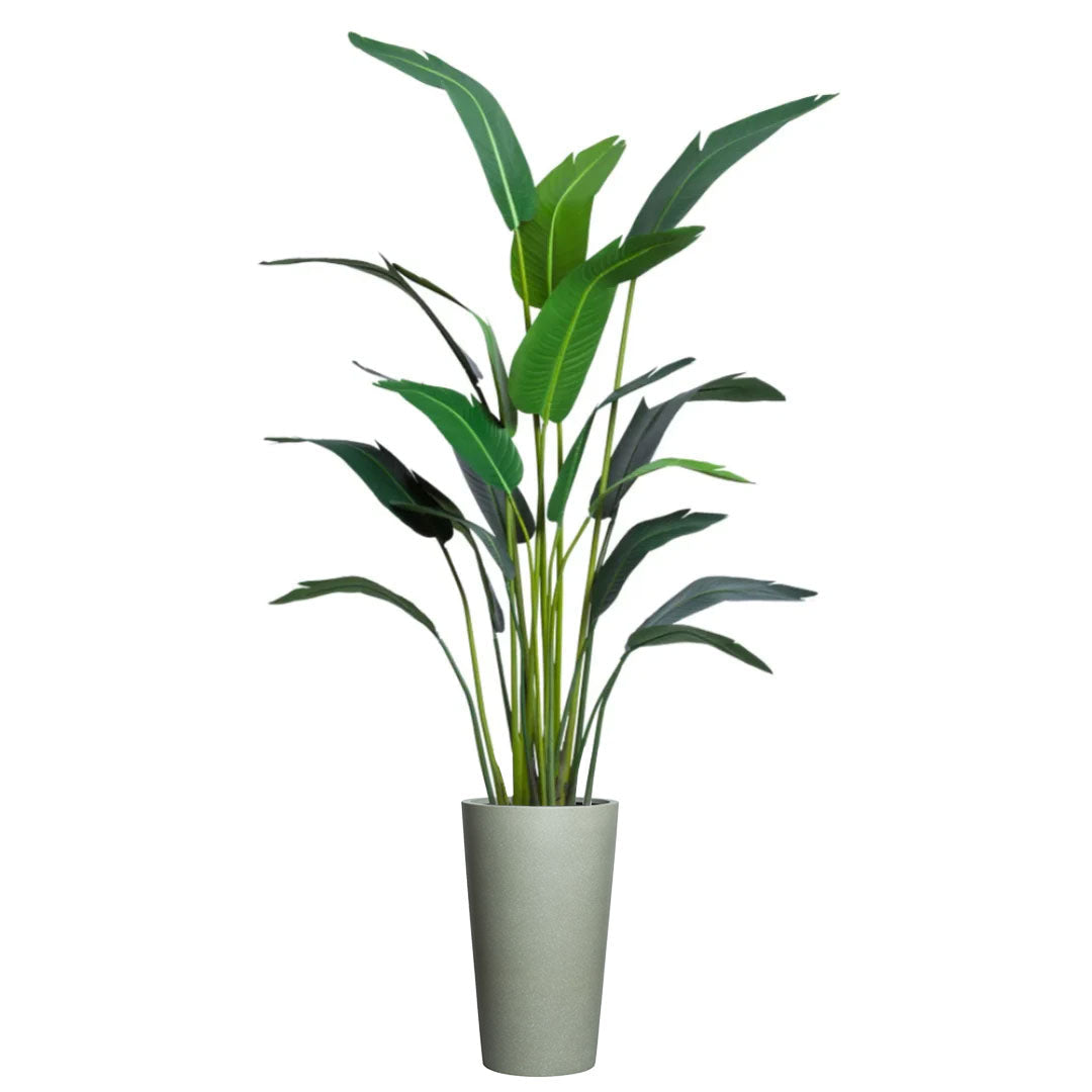 Artificial tropical palm plant with long green leaves in a tall greystone planter