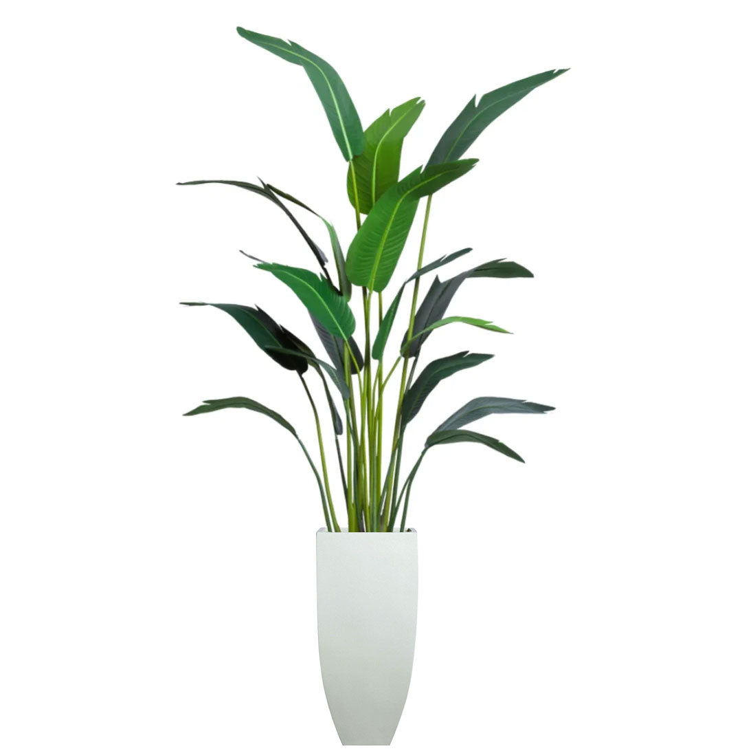 Artificial palm plant with tall green leaves in a modern white planter, isolated on white background