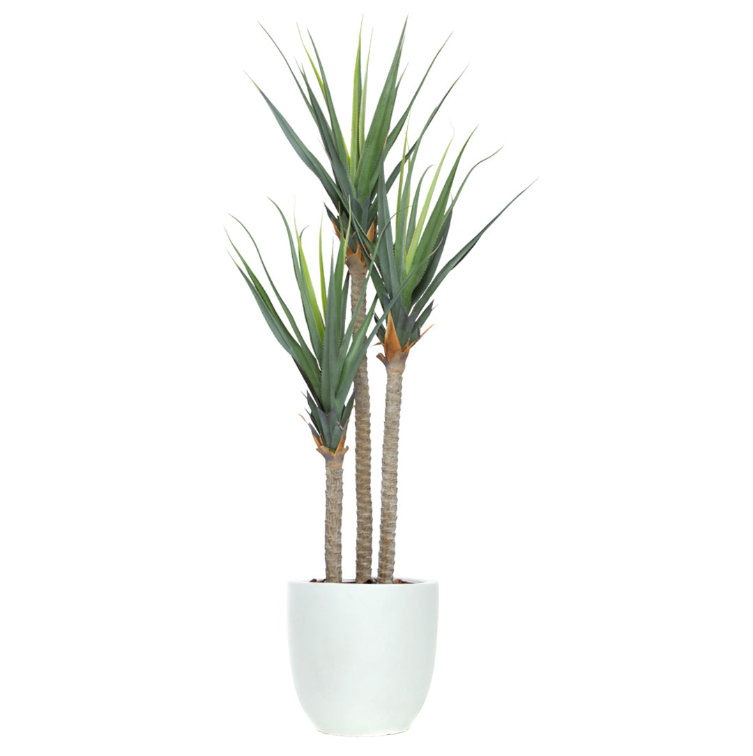 Artificial pandanus plant with tall green leaves in a white pot on a white background