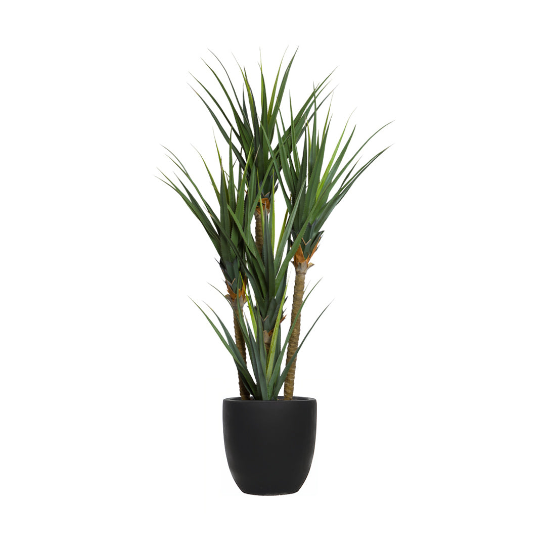 Artificial pandanus plant with long green leaves in a black pot on white background