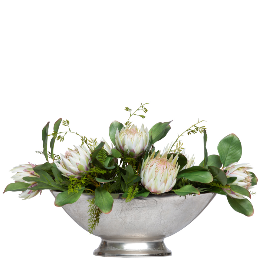 Artificial protea and fern floral arrangement in a silver bowl centerpiece