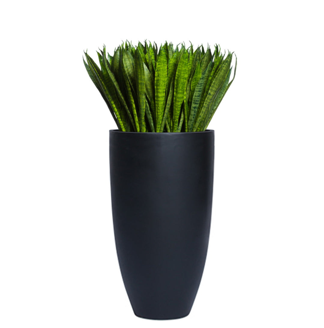 Artificial Sansevieria plant in sleek tall black planter, modern decorative greenery