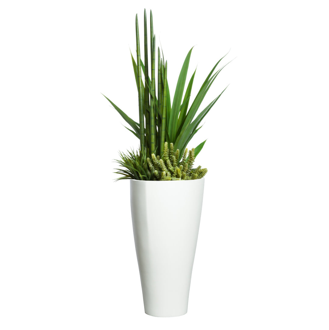 Artificial succulent mix with tall green foliage in a modern white planter