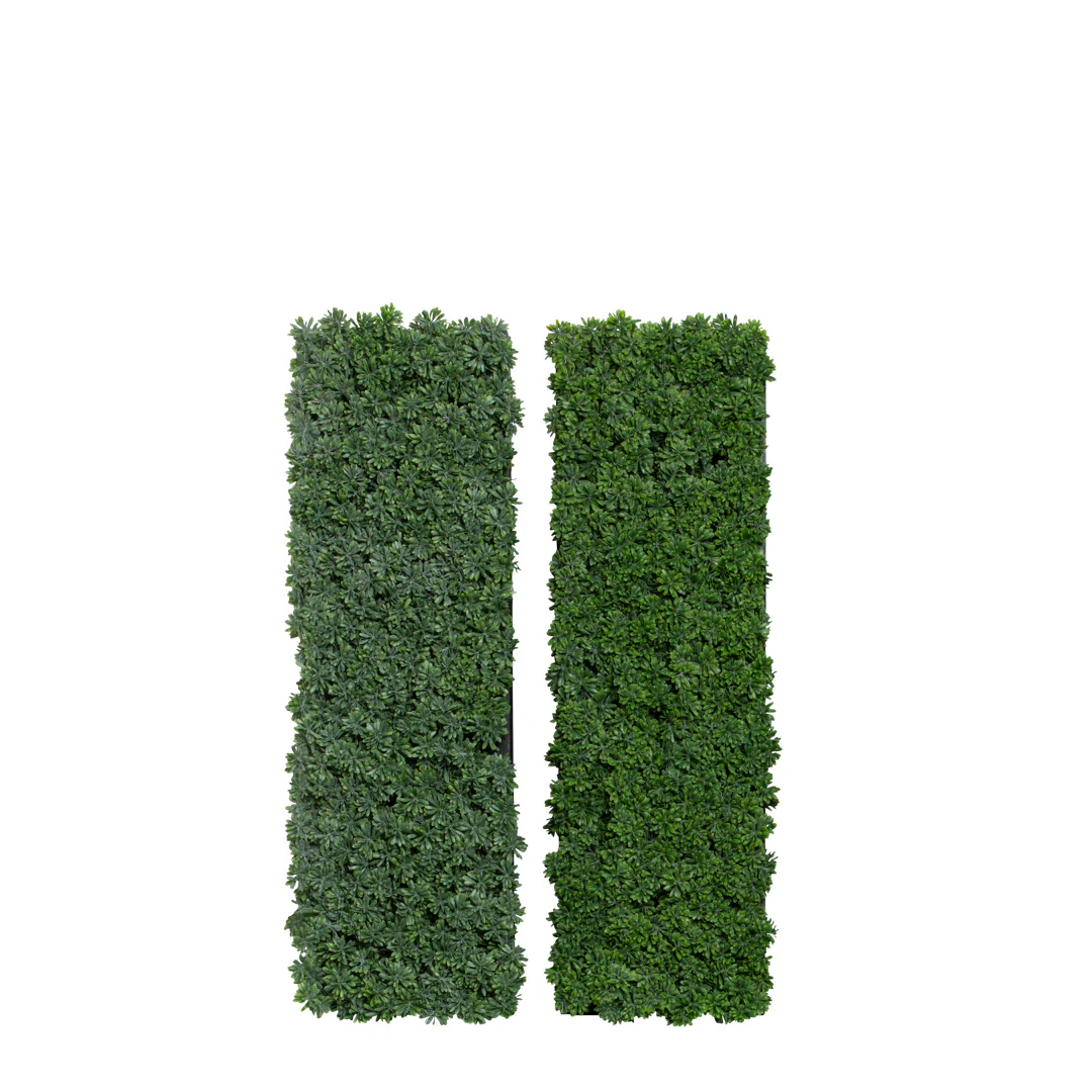 Artificial succulent grass wall panels with dense green foliage, isolated on white background.