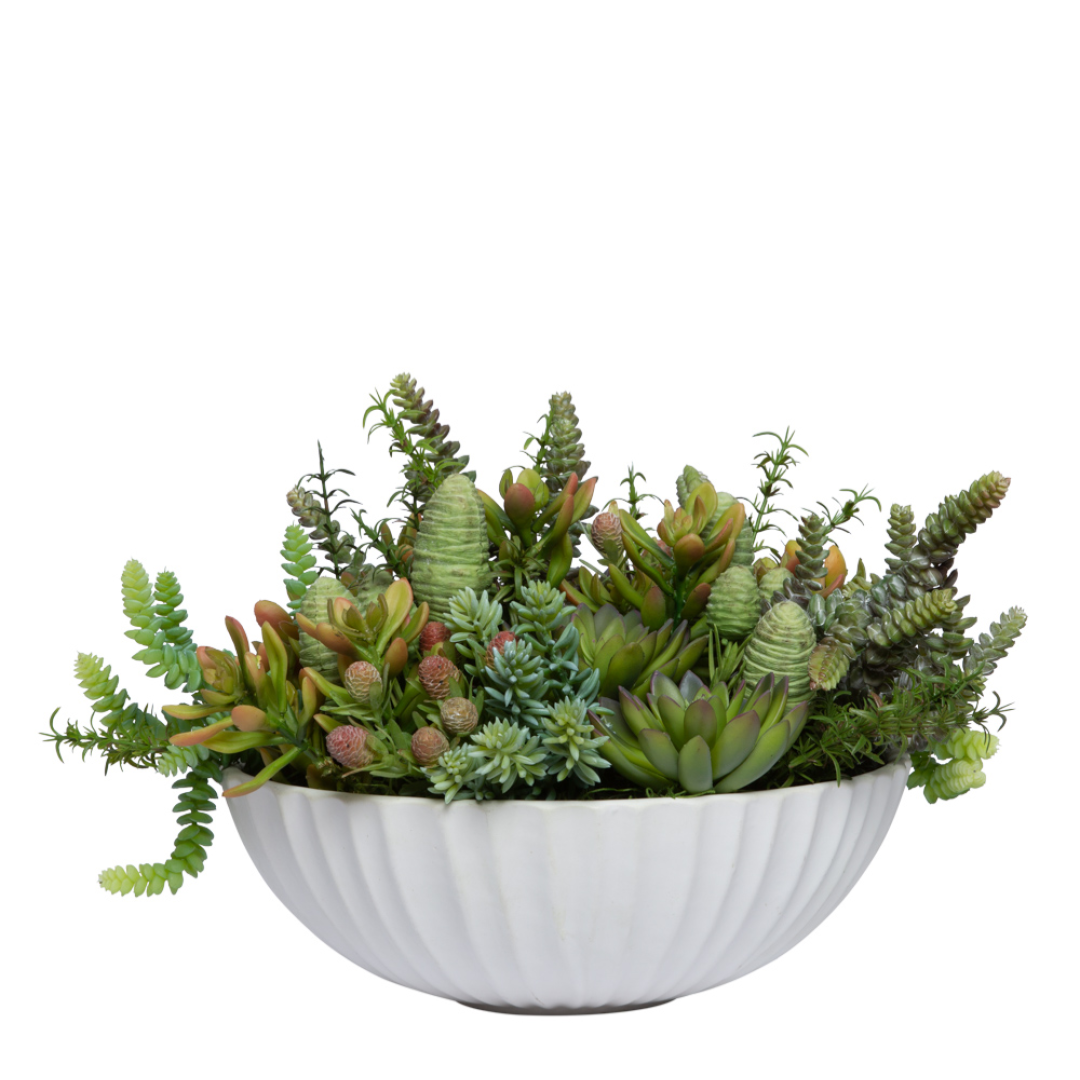 Artificial succulent arrangement in a white ceramic bowl, mixed green and red tones
