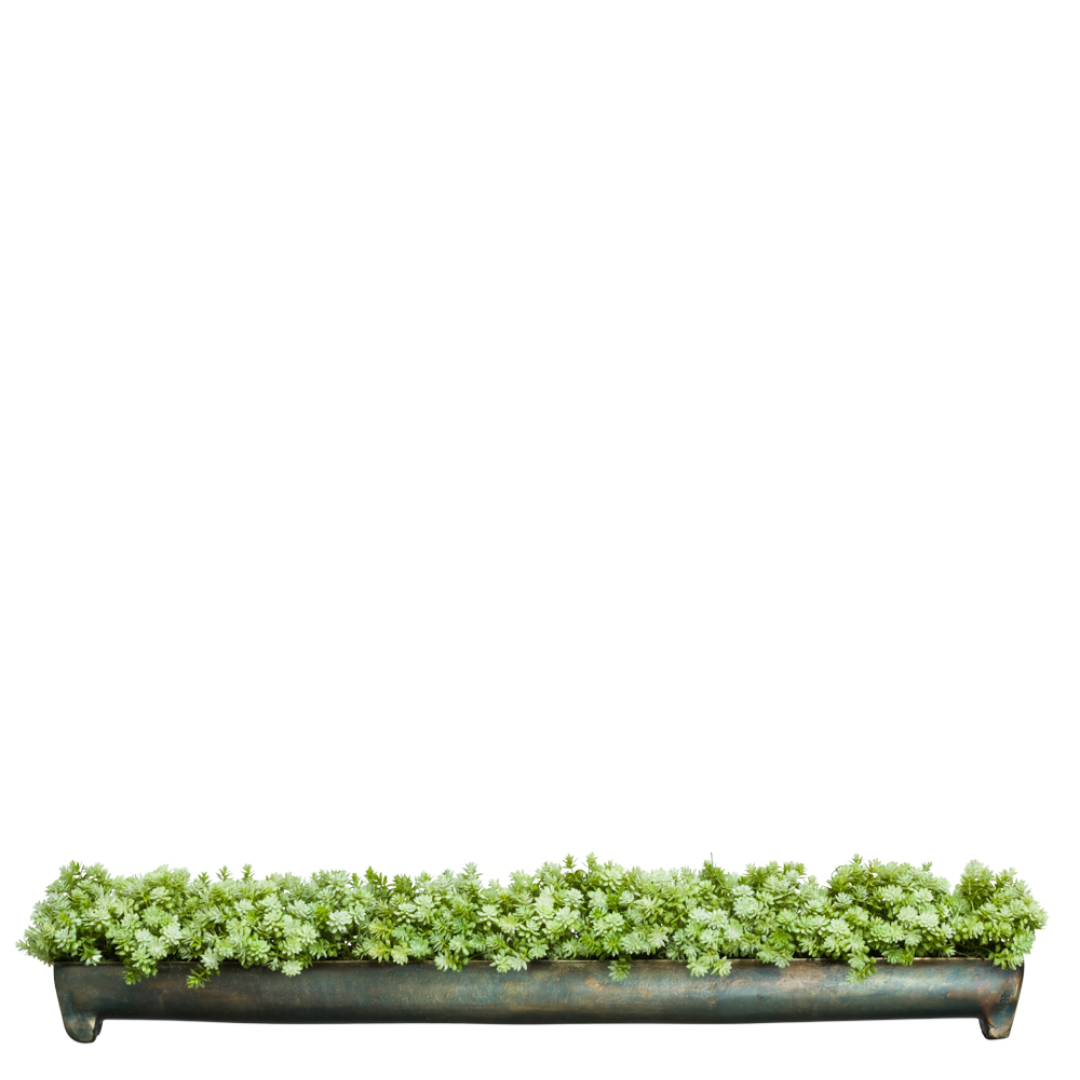 Artificial succulent sedum arrangement in a long rustic planter