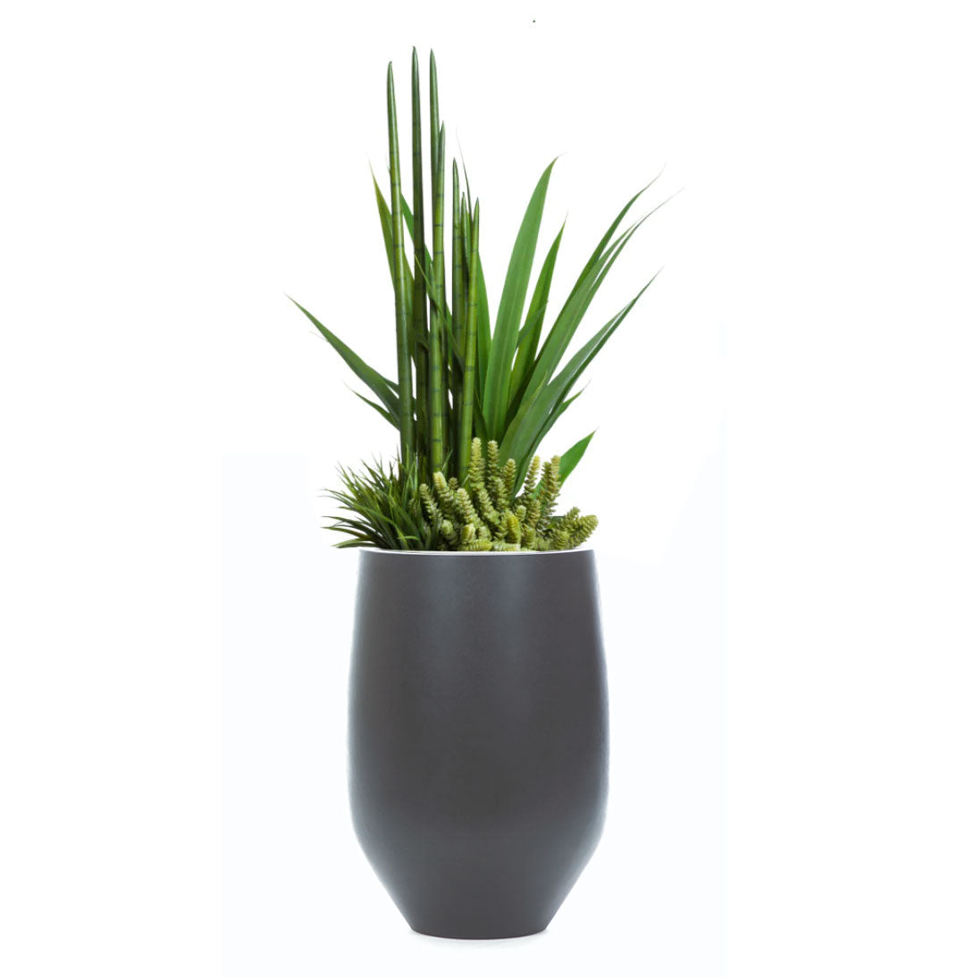 Artificial succulents and greenery in modern black tapered planter