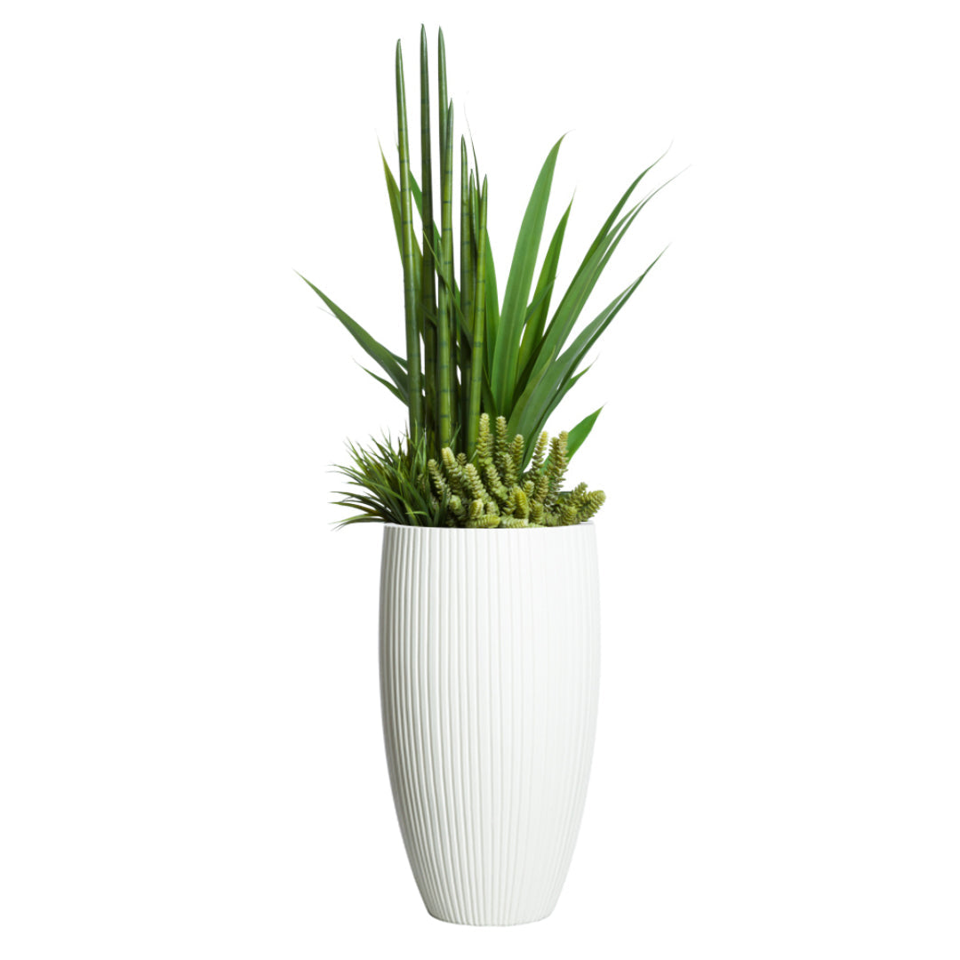 Artificial succulent greenery arrangement in tall white ribbed planter