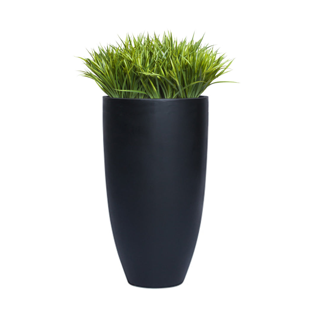 Artificial sword grass in tall smooth black planter, modern decorative faux plant