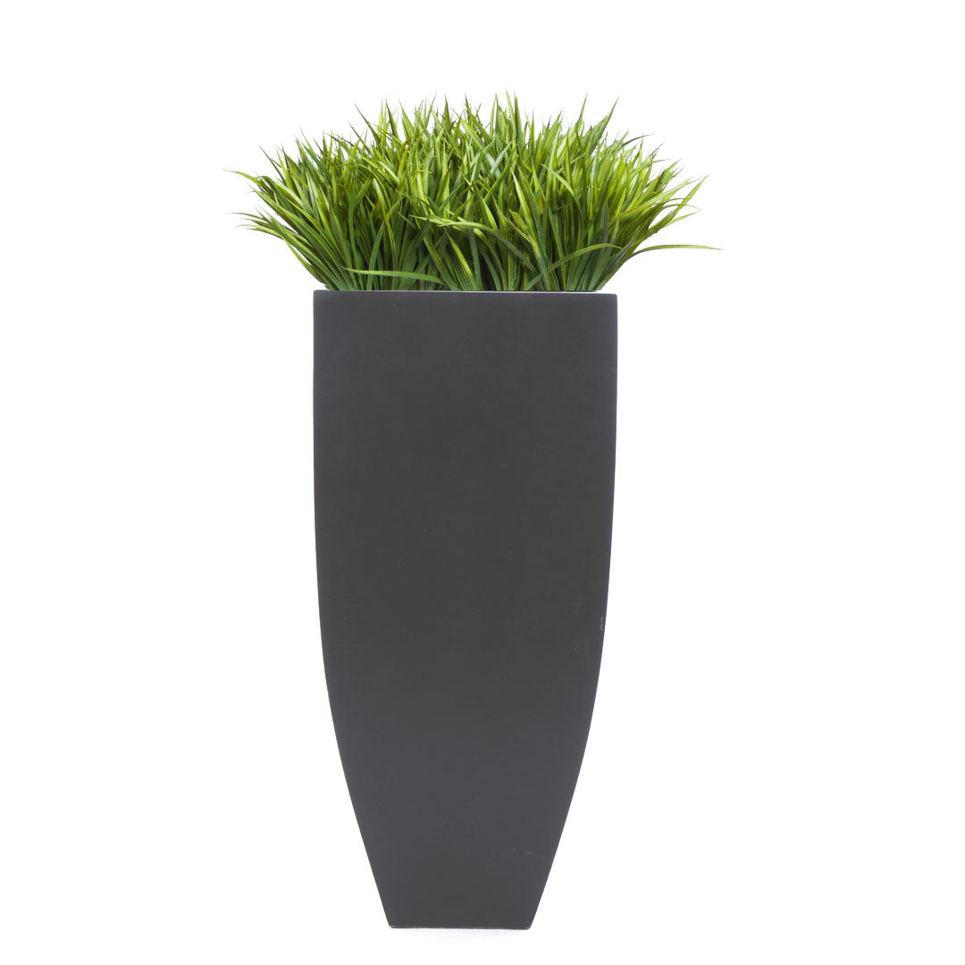 Artificial sword grass in tall black planter, modern decorative faux plant arrangement