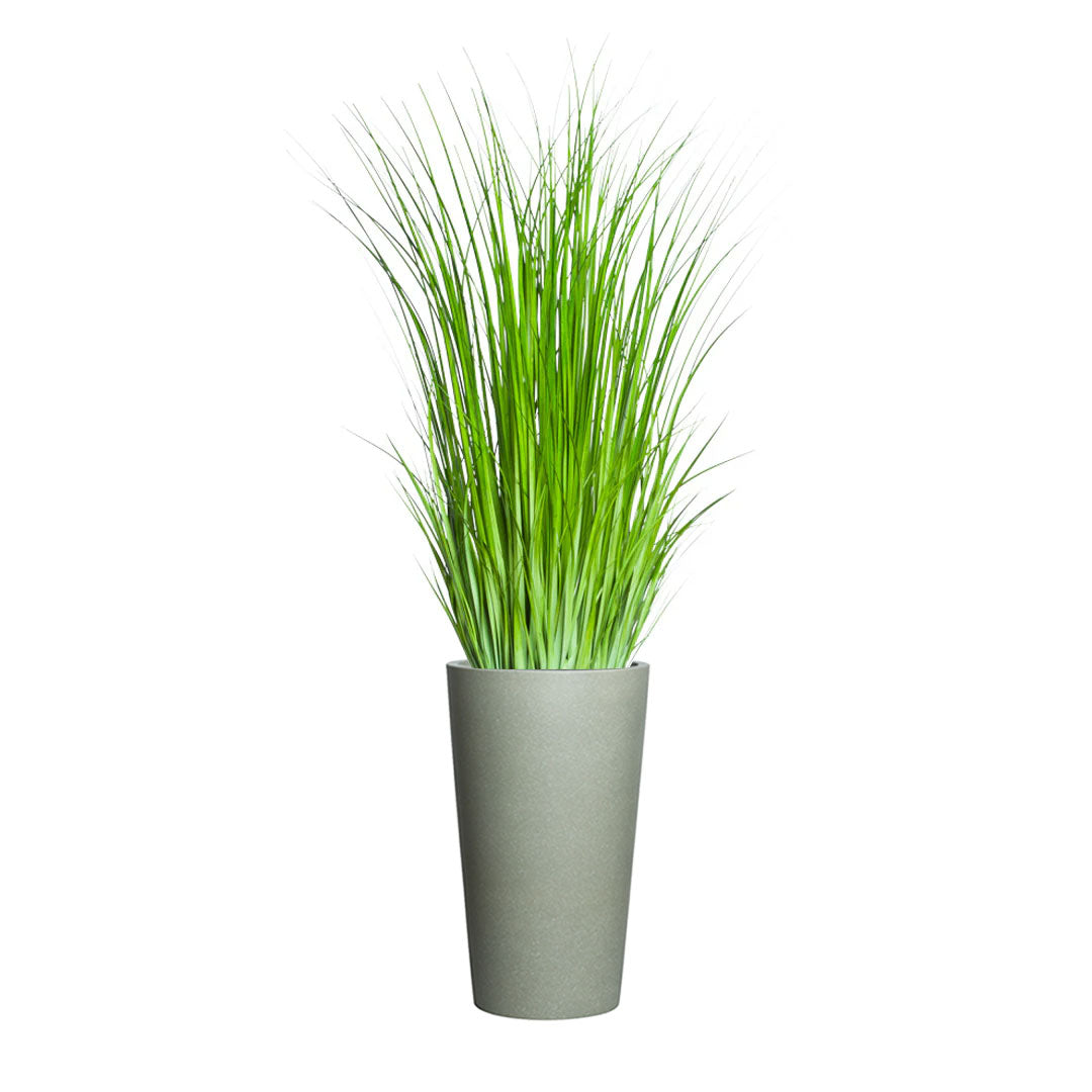 Artificial wild grass in a tall greystone planter on white background