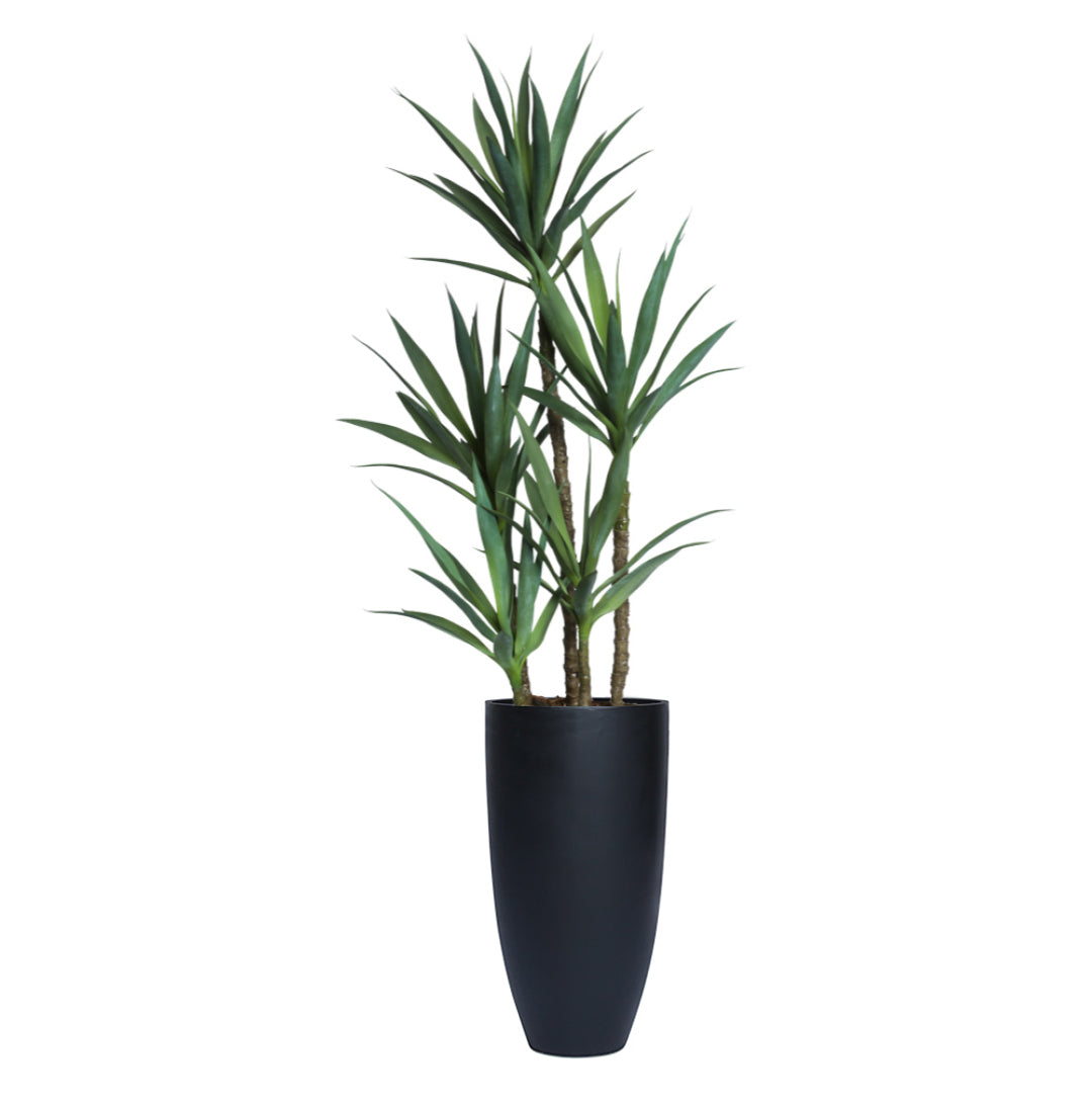 Tall artificial yucca plant in a sleek black planter with smooth finish