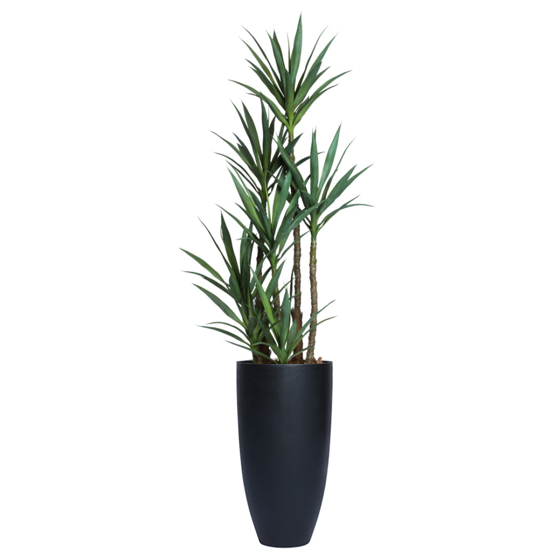 Tall artificial yucca plant with green leaves in a sleek black smooth planter