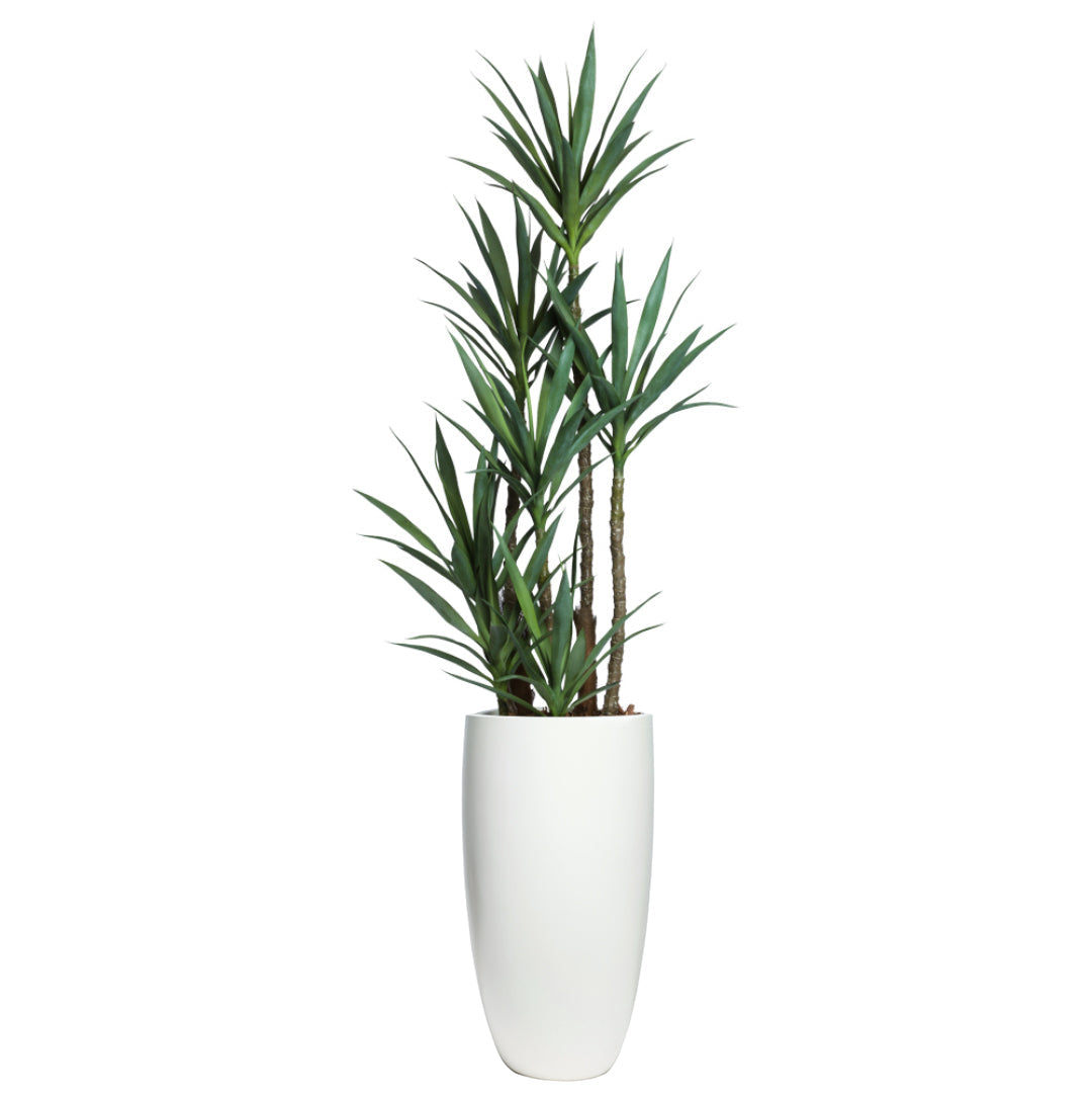 Tall artificial yucca plant with green leaves in a smooth white planter, realistic decor