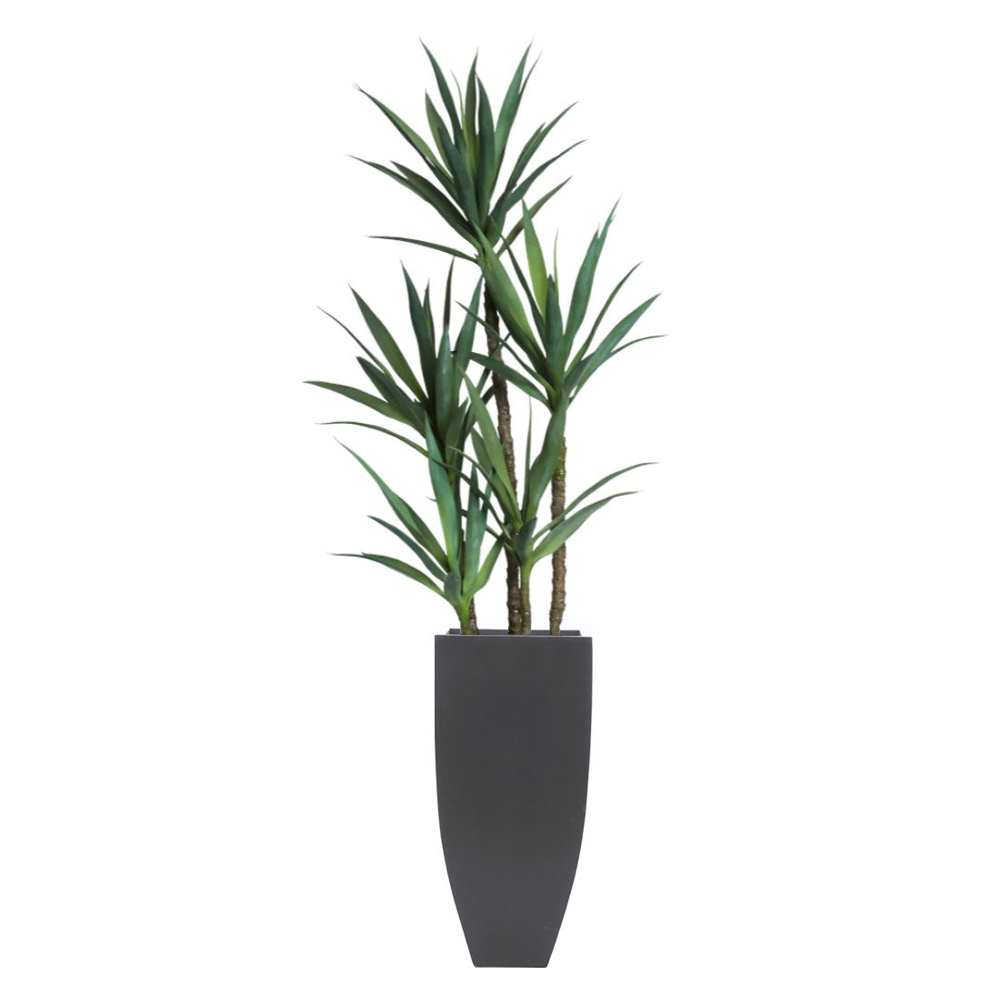 Artificial yucca plant in a tall modern black planter, realistic green foliage