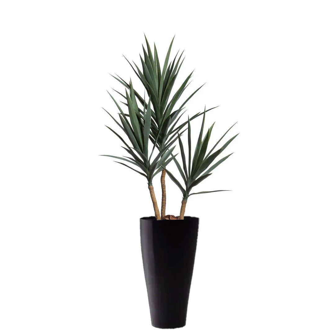 Artificial yucca plant in tall black planter with realistic green leaves