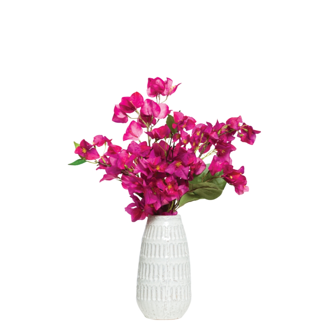 Fuchsia bougainvillea artificial floral arrangement in a white textured vase