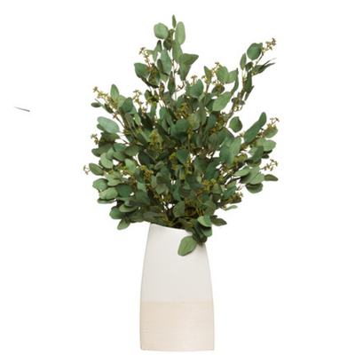 Artificial eucalyptus arrangement in a modern white ceramic vase, realistic green foliage