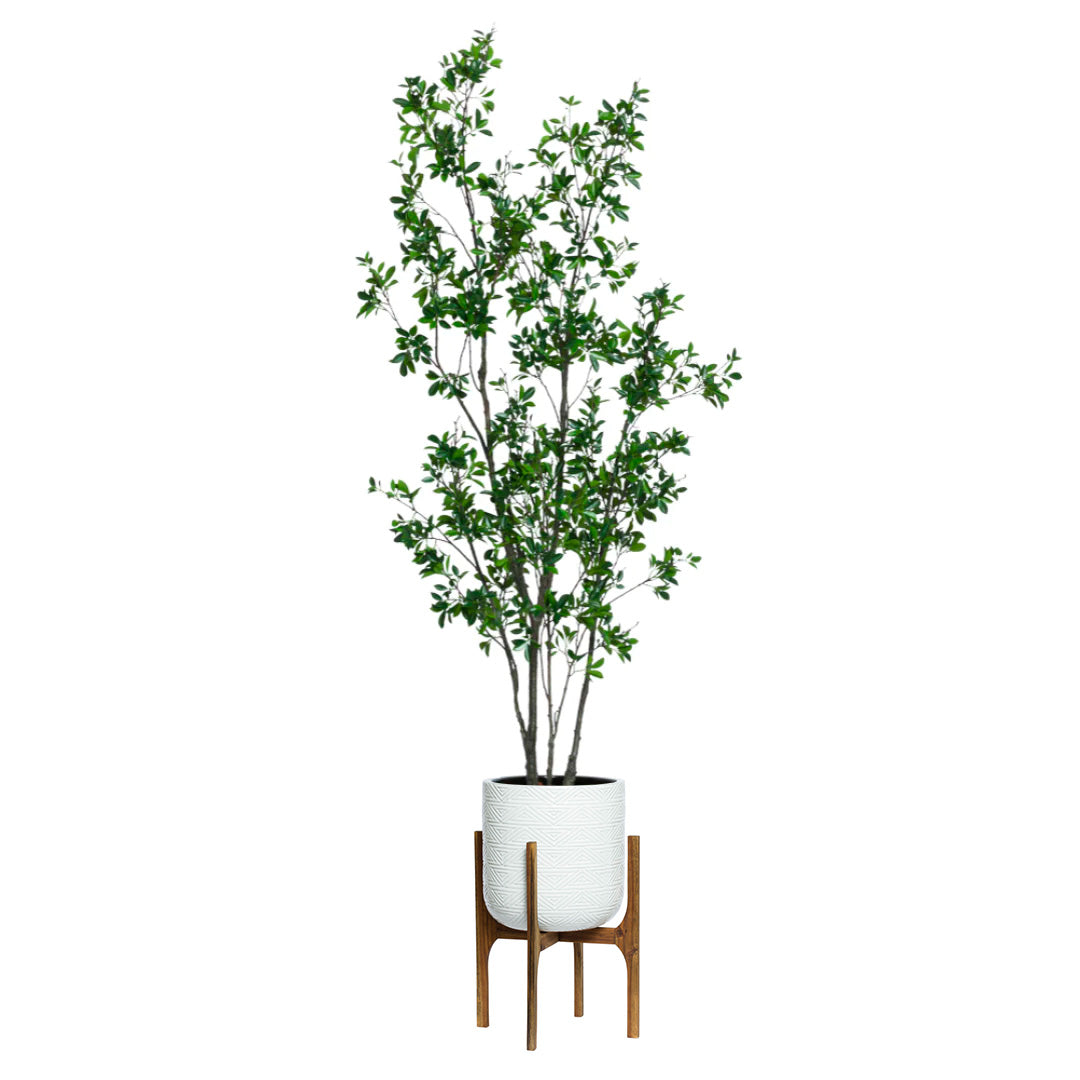 Artificial ficus tree with green leaves in white planter on wooden stand, isolated on white