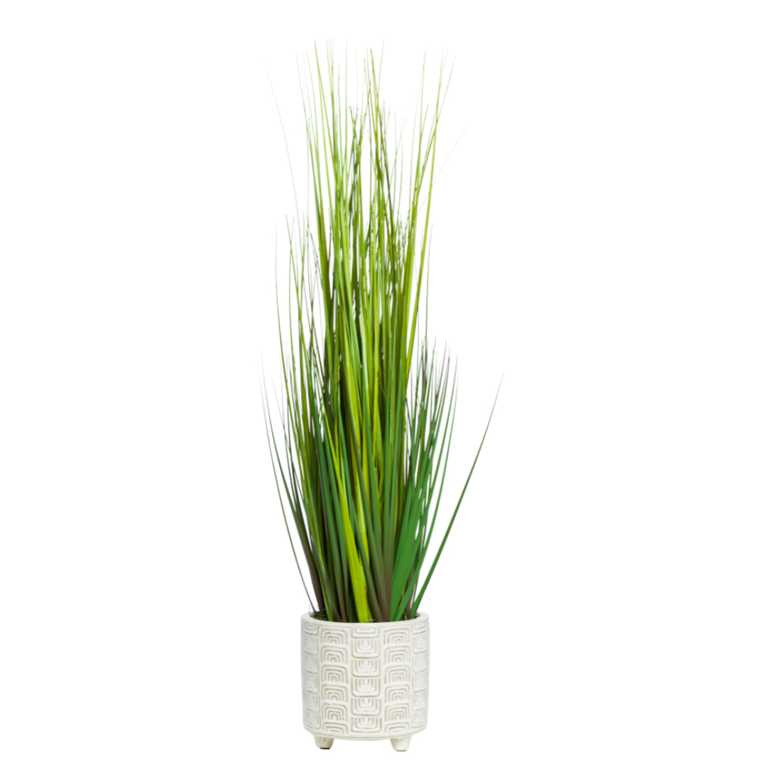 Artificial grass plant in a textured white ceramic footed pot, modern home decor