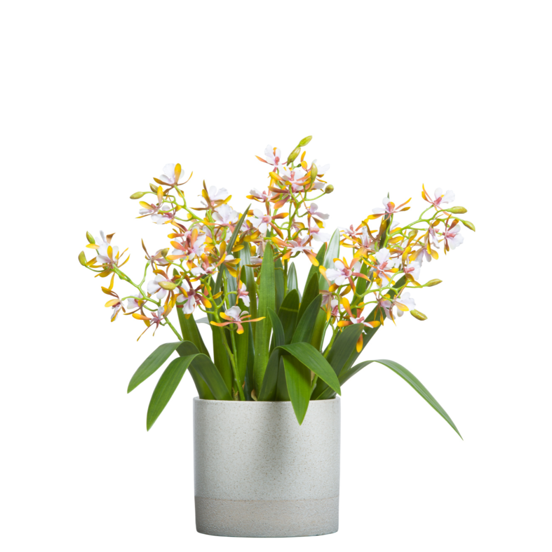Artificial orchid arrangement with white blooms in a modern ceramic pot, lifelike floral decor