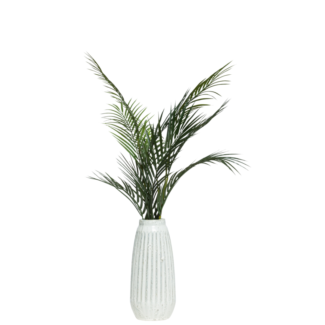 Artificial palm frond spray in tall white textured vase, botanical decor accent