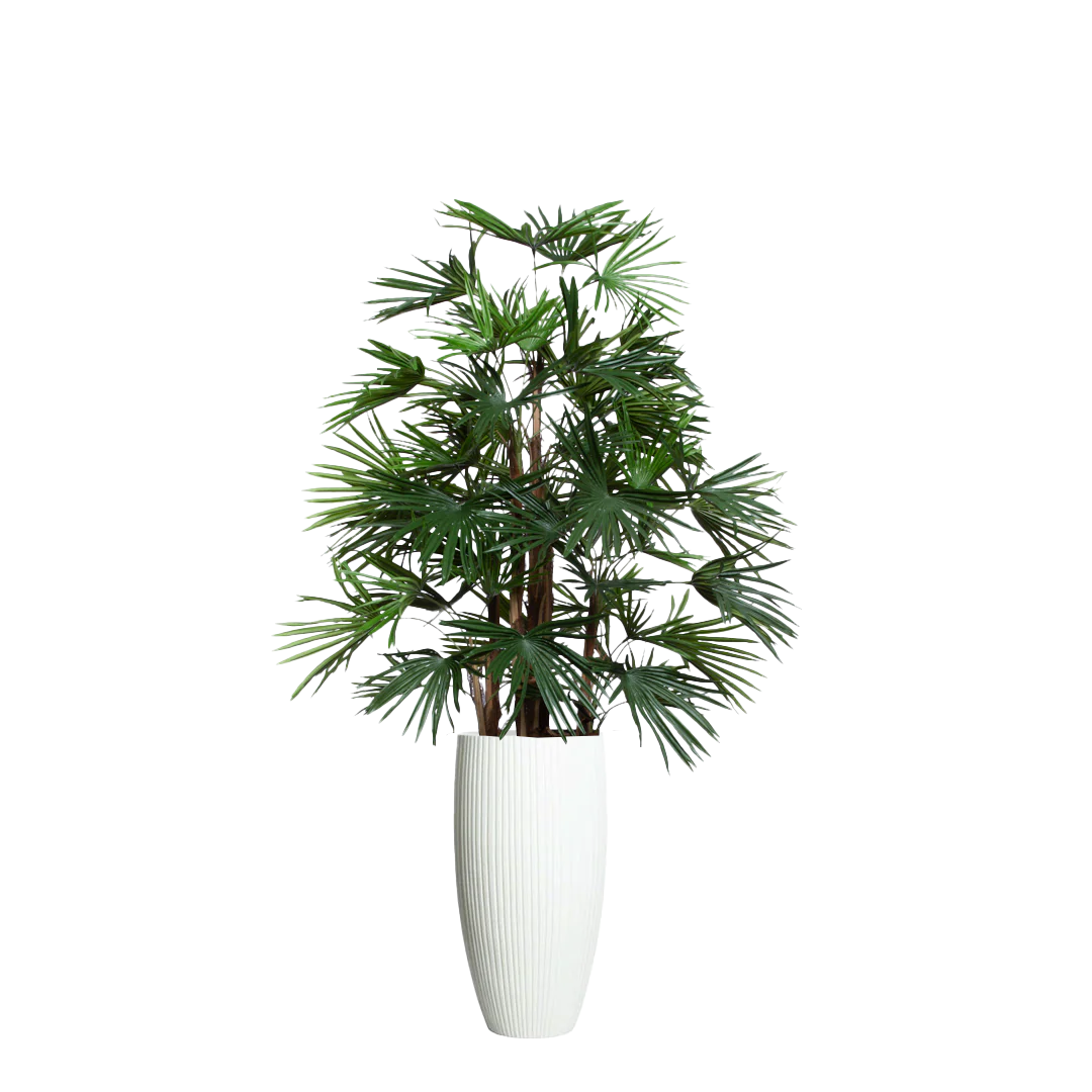 Artificial raphis palm plant in tall white ribbed planter, realistic greenery decor