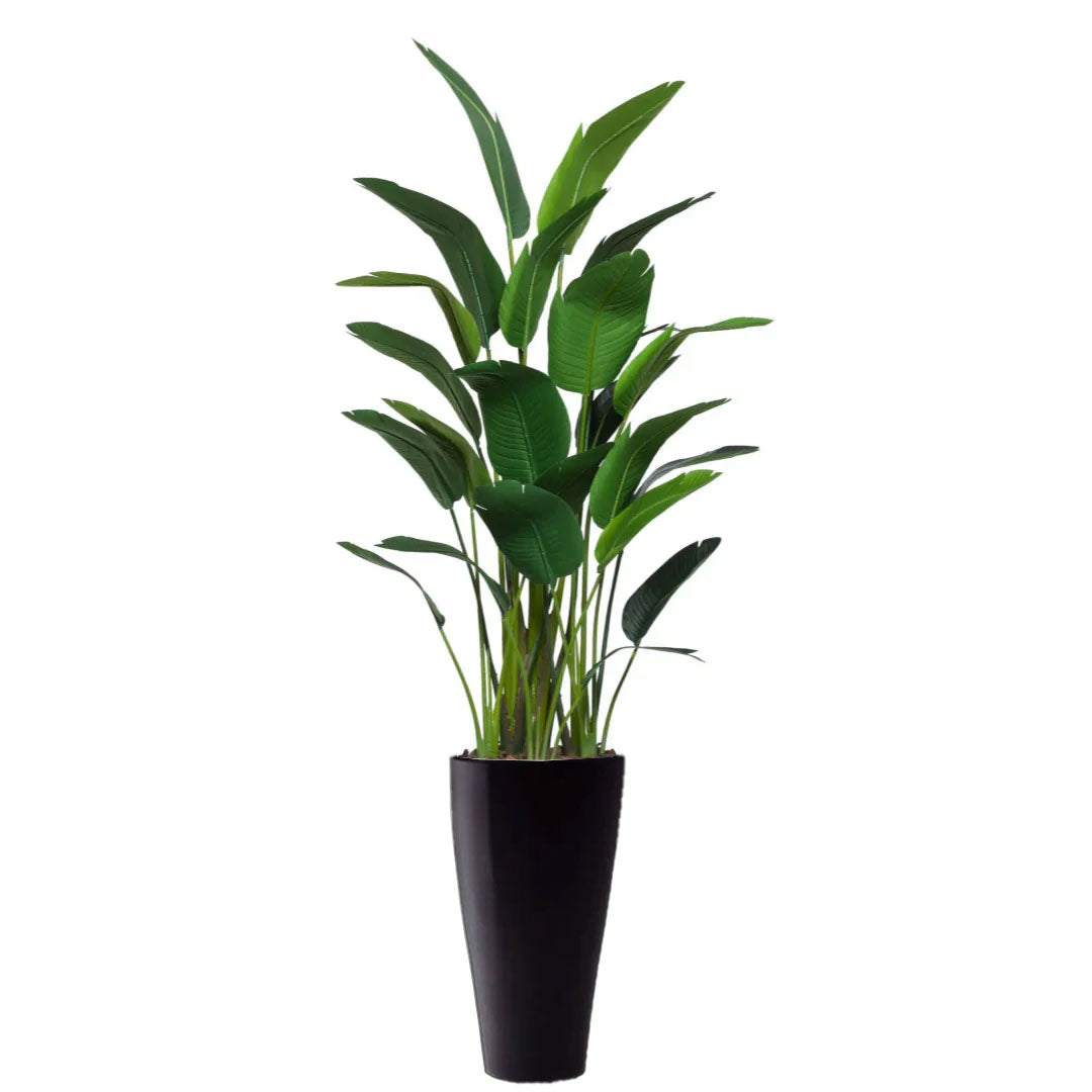 Artificial tropical palm plant with lush green leaves in a tall black planter