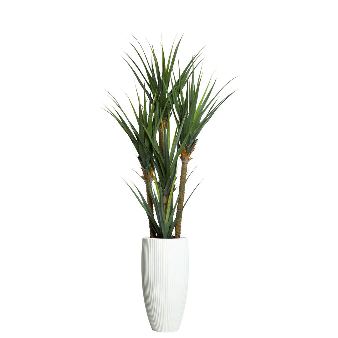 Artificial pandanus plant with spiky green leaves in a tall white ribbed planter