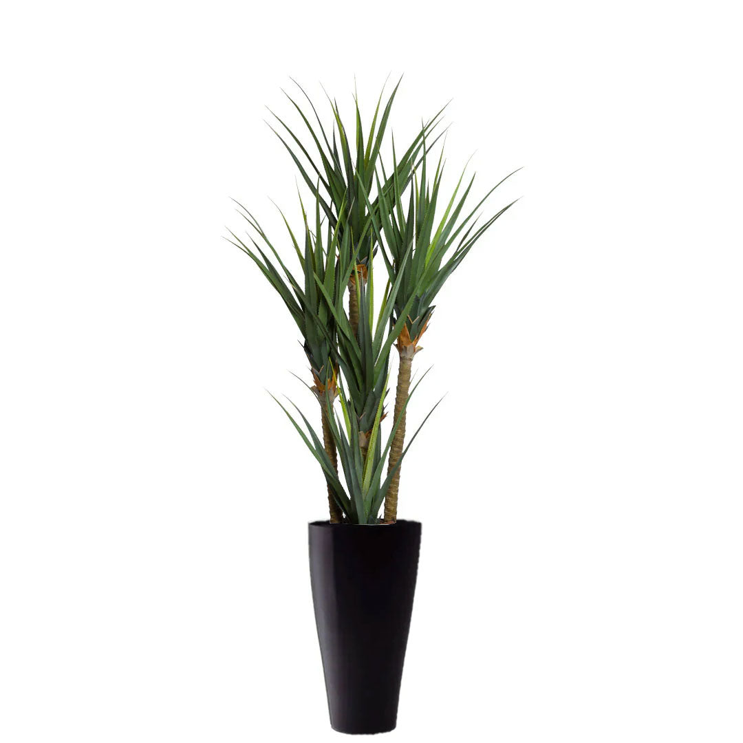 Artificial pandanus plant with long green leaves in a tall black planter on white background