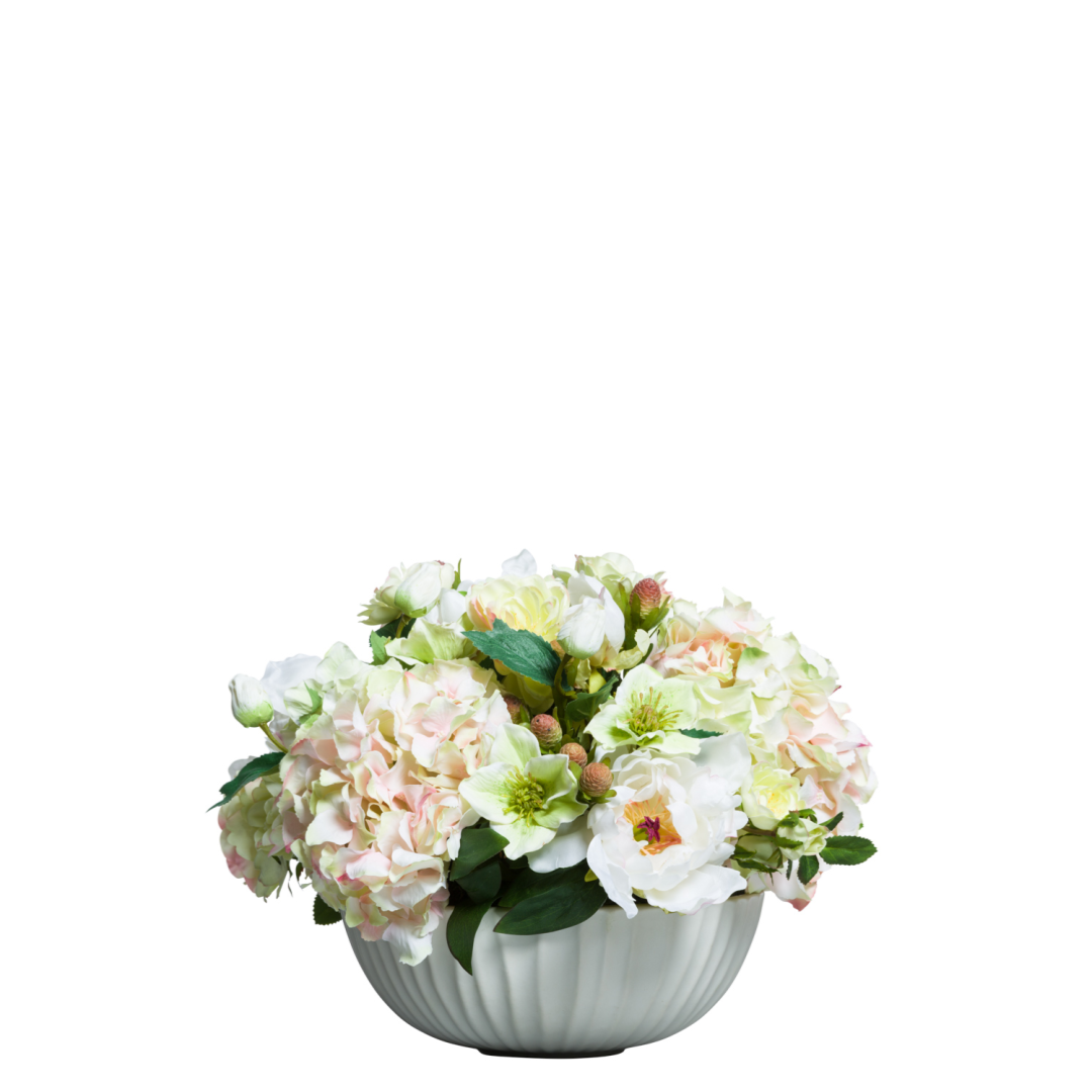 Silk arrangement of roses, hydrangeas, and peonies in a white bowl vase