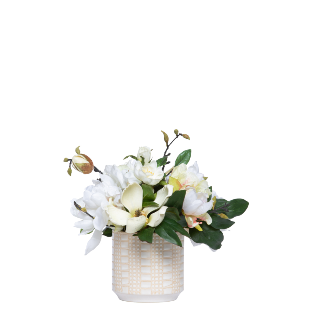 Artificial white rose and peony arrangement in a decorative ceramic vase