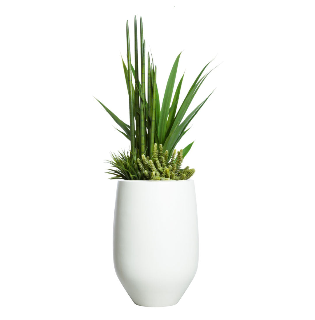 Artificial succulents and greenery in a modern white tapered planter