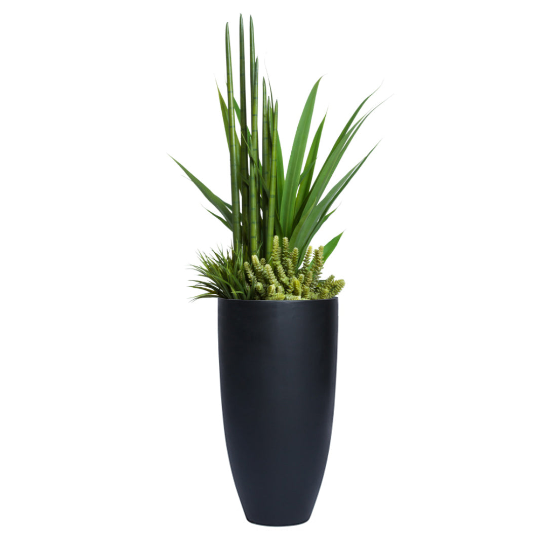 Artificial succulent and greenery arrangement in a tall black planter