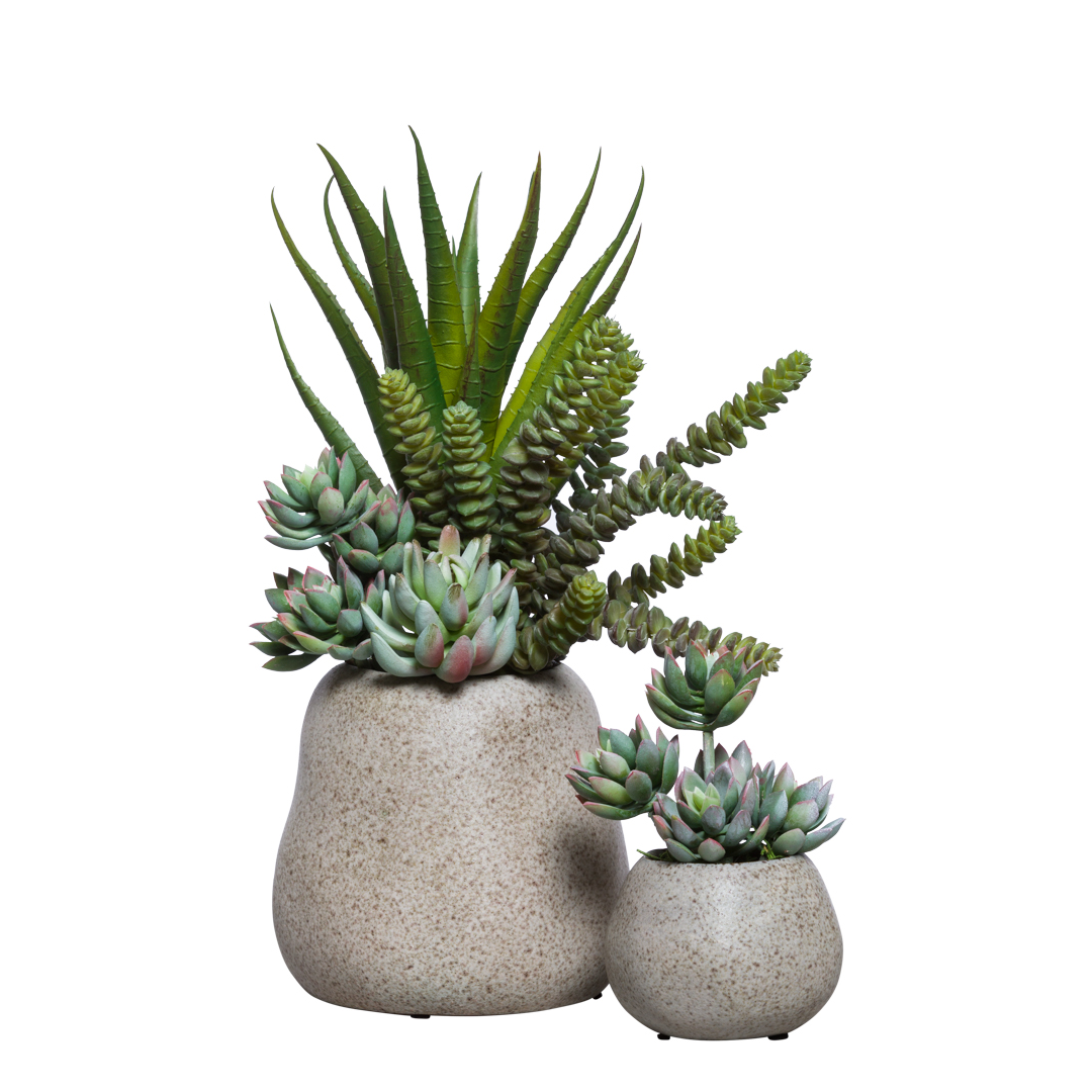 Artificial succulent arrangement in two stone-textured pots on white background