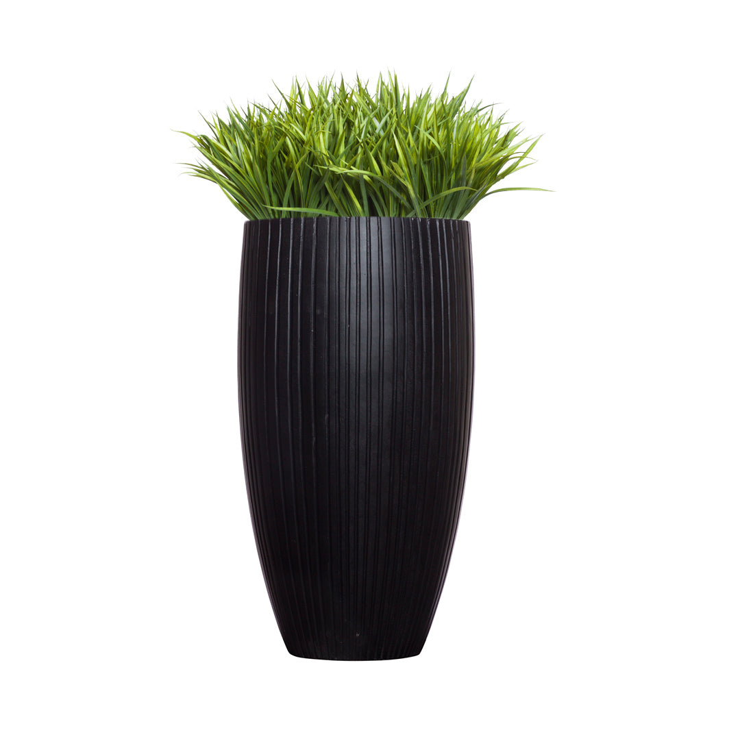 Artificial sword grass arrangement in tall ribbed black planter