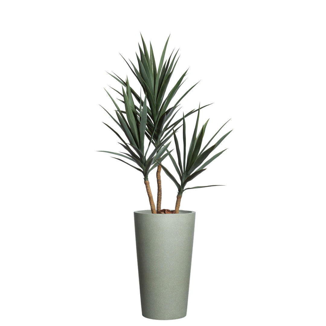 Artificial yucca plant with green leaves in a tall greystone planter